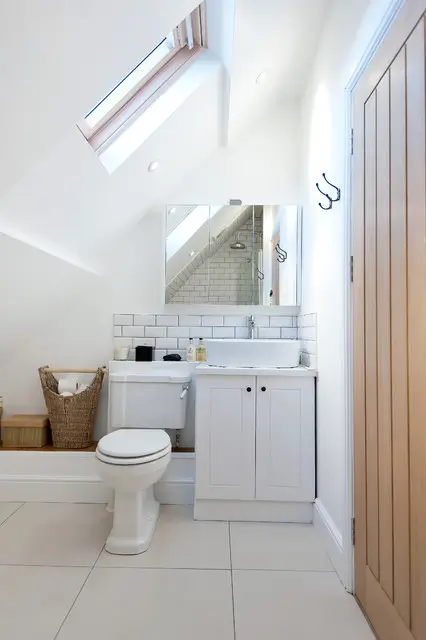 Built-in storage and wall niches featured in a smart Small Bathroom Renovations by Bathroom Renovations North Shore.
